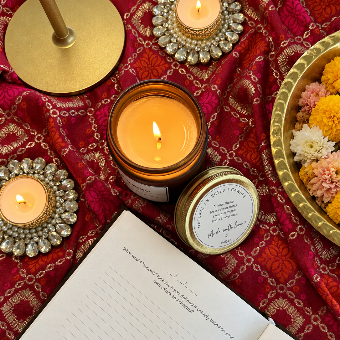 Candle lit beside the journal